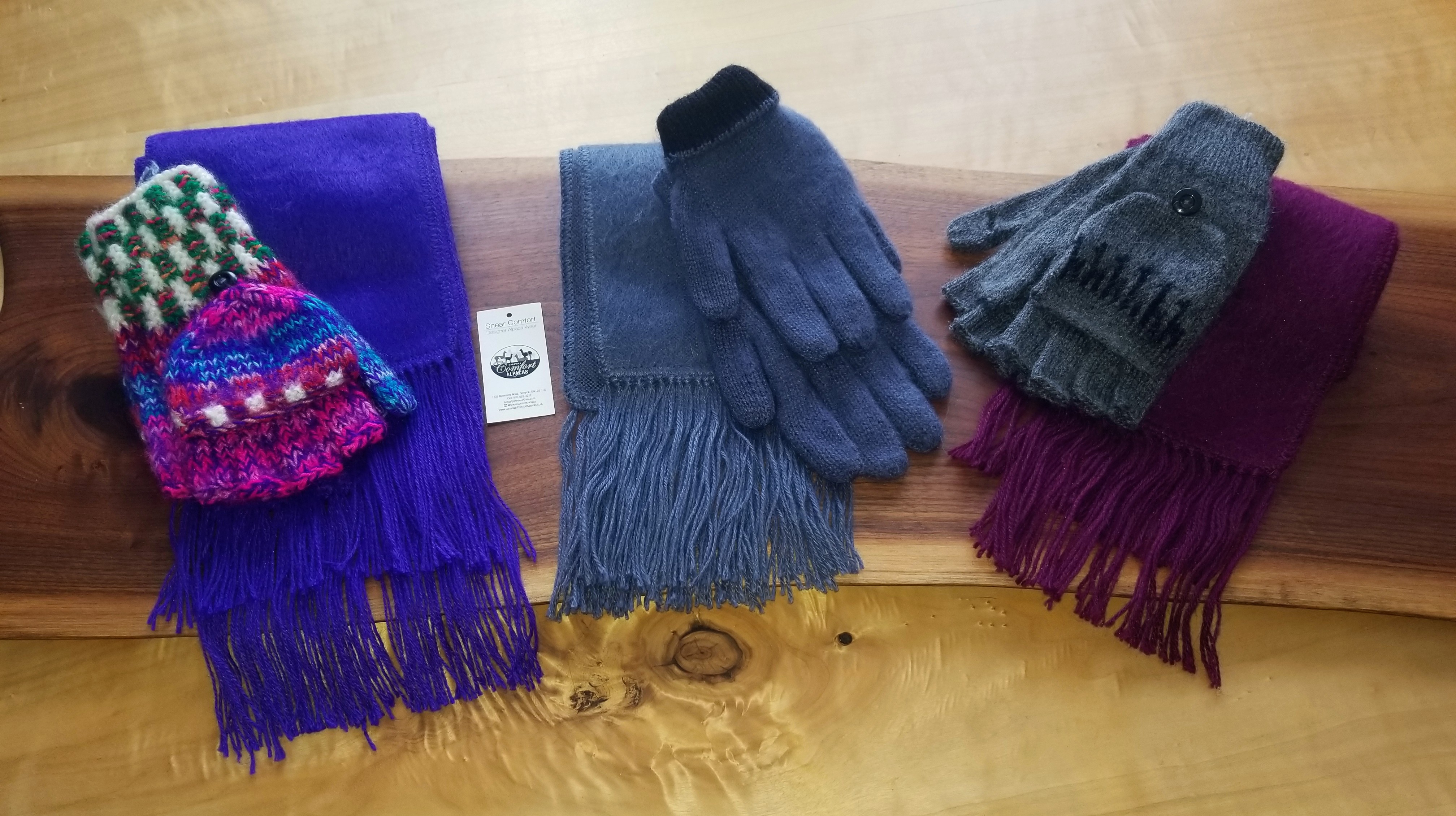 Pink and blue mitts and scarves.